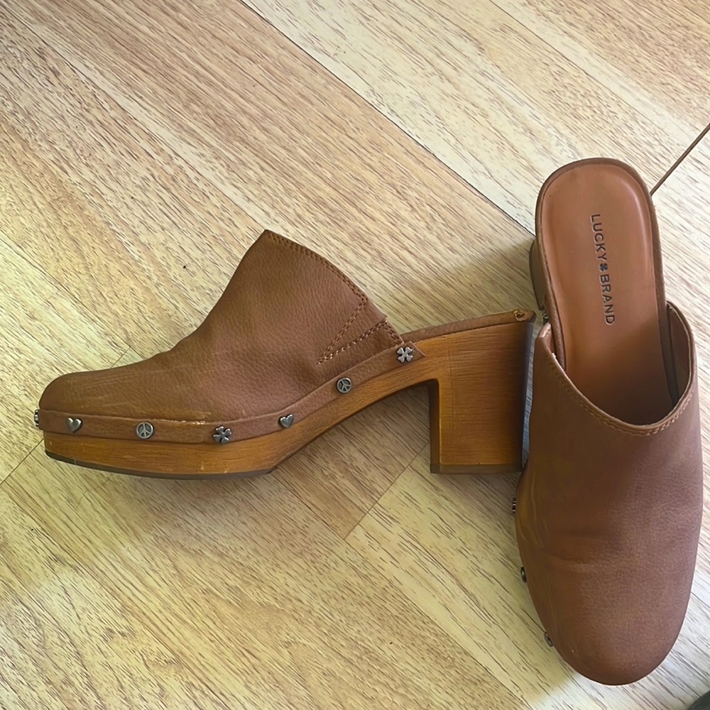 Lucky brand clog brown leather a few scuffs peace sign hearts grommets.